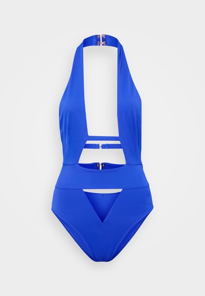 Modrý jednodílný plavky s hlubokým výstřihem, výřezy a akcenty ze zlatého hardwaru. Vyrobeno z hladkého, elastického materiálu.
