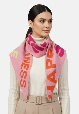 Pink knitted scarf featuring bold, colorful text in orange and magenta. Soft texture with a triangular shape, draped around a person’s neck.