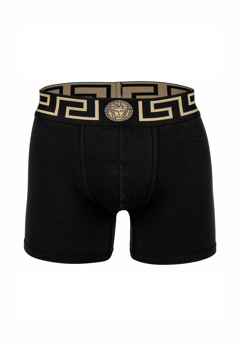 Black boxer briefs made of a soft fabric. Features a gold patterned waistband with a iconic logo at the center. Smooth texture and fitted design.