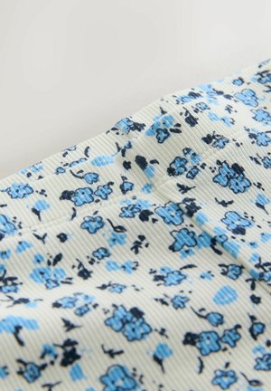 Kvetinová látka s svetlomodrými a námorníckymi kvetmi na krémovom rebrovanom pozadí. Hladká textúra s jemným elastickým efektom.