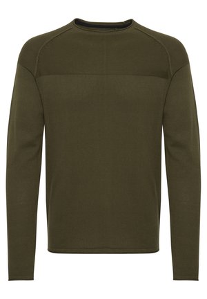 Pulover lung cu mânecă, de culoare verde măslin, confecționat dintr-un material tricotat texturat. Are un decolteu rotund și cusături contrastante la umeri.