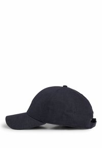 Navy blue cap made from textured fabric, featuring a curved visor, six-panel design, and an adjustable strap at the back.