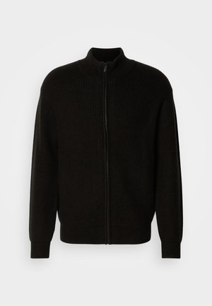 Schwarze Zip-Up-Jacke mit gerippter Textur, hohem Kragen und langen Ärmeln. Hergestellt aus weichem Material in lockerer Passform.