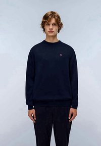 Sweatshirt azul-marinho com decote redondo, mangas compridas, punhos e bainha canelados. Apresenta um pequeno logótipo no peito. Material de algodão suave.