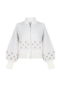 Hvitt zip-up cardigan laget av teksturert strikkemateriale. Har puffermer og ribbestrikket kant, med subtile brune "H"-mønster aksenter.