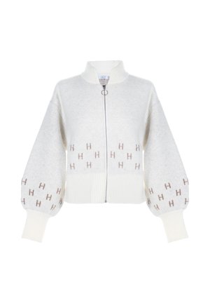 Vit zip-up kofta i texturerad stickad material. Har puffärmar och ribbad fåll, med subtila bruna "H"-mönsterbetonningar.