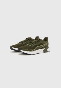 Olive green athletic shoes with mesh upper, white midsole, and black rubber outsole. Features laces and subtle logo accents.