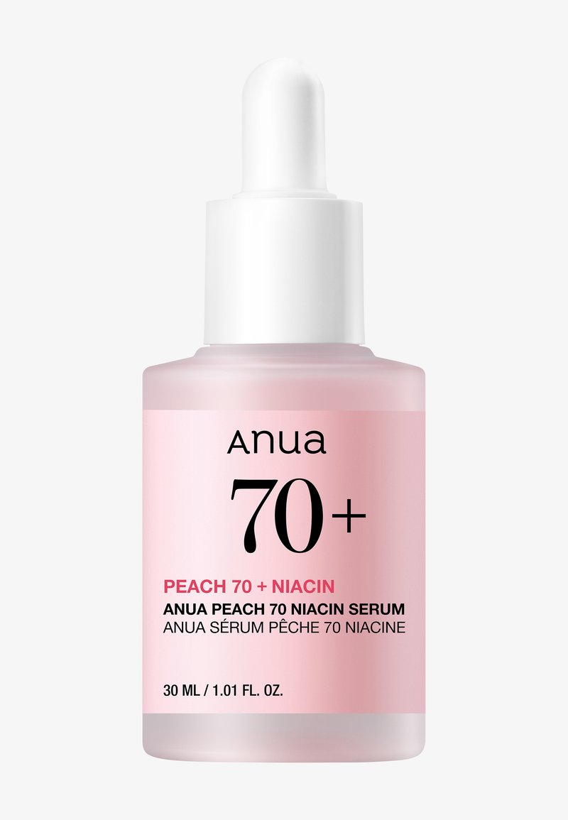 Pink glass dropper bottle labeled Anua Peach 70 Niacin serum, 30 ml, with white dropper cap against a light background.