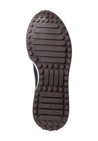 Suela de zapato con una superficie de goma negra texturizada que presenta patrones circulares y rectangulares, diseñada para ofrecer tracción y durabilidad.