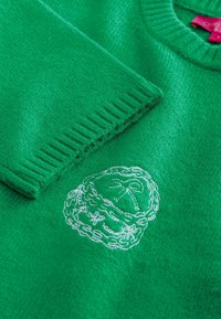 Unselected, bright green embroidered graphic