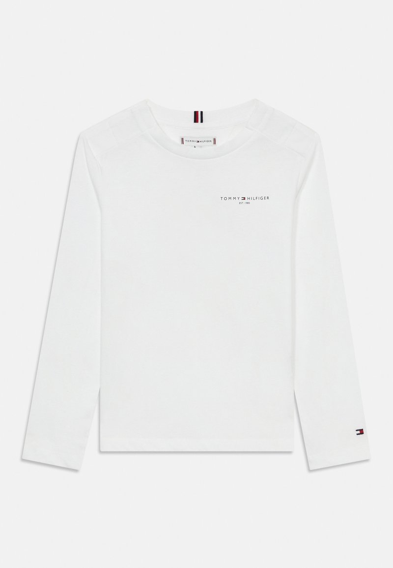 Valge pika varrukaga T-särk ümmarguse kaelusega, millel on rinnal väike "Tommy Hilfiger" logo ning varrukal punane, valge ja sinine aktsent.