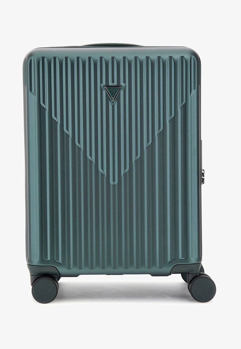 Valise rigide teal avec texture à rainures verticales, logo triangulaire et quatre roues noires pour la mobilité. Design compact et durable.