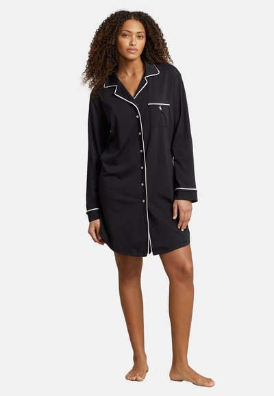 Schwarzes, langärmeliges Nachthemd mit weißen Paspeln, Knopfverschluss und einer Brusttasche. Hergestellt aus weichem Stoff, knielanger Schnitt.