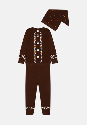 Rudos pižamų rinkinys apima ilgomis rankovėmis marškinius su spalvingais akcentais ir derančią skrybėlę su taškeliais. Pagamintas iš minkštos medžiagos, su švelniais rankogaliais.