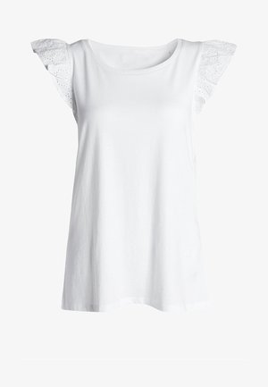 Valkoinen hihaton toppi, joka on valmistettu puuvillasta, ja jossa on pitsiset frillahihat sekä pyöreä pääntie. Mallissa on rento leikkaus ja sileä pinta.