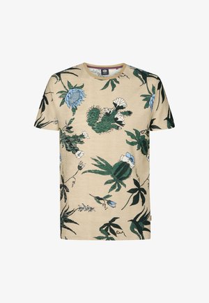 Tricou din bumbac bej cu mâneci scurte, cu un imprimeu botanic colorat ce prezintă cactuși verzi, flori albastre și albe și frunze verde închis.