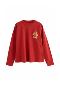 Röd långärmad t-shirt i bomull med en pepparkaksgubbe-applikation på vänster bröst. Avslappnad passform med rund halsringning.
