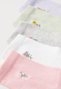 Five pairs of socks in pastel colors—pink, white, gray, green, and lavender—each with floral embroidery detailing. Soft, textured fabric.