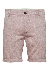 Shorts en lin rouge pâle avec une finition texturée, dotés d'un ourlet replié, d'une fermeture à bouton à l'avant et de passants de ceinture.