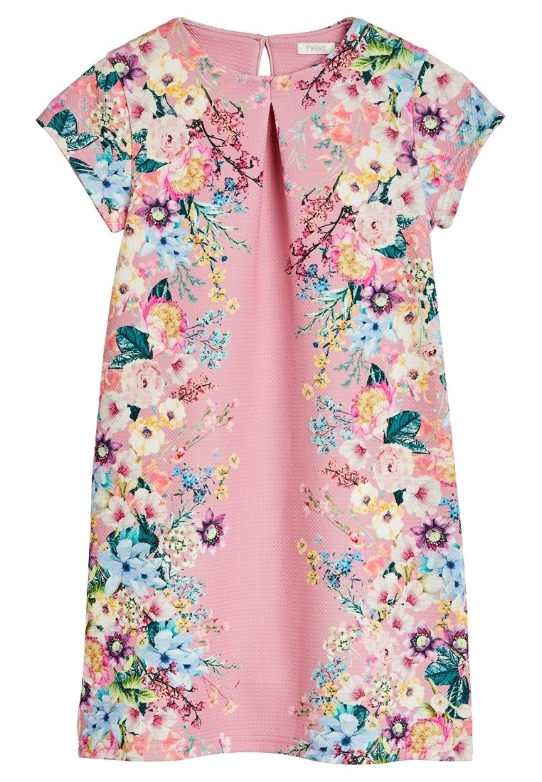 Vaatteet kukkakuosisessa vaaleanpunaisessa kankaassa, jossa on hihattomat hihat, pyöreä pääntie selässä avautuvalla aukolla ja eloisia kukkakuvioita sivuilla.