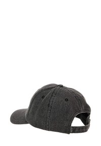 Black denim baseball cap with adjustable strap, curved visor, and six-panel design. Features black eyelets and a small branding tag.