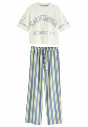 Crop top i bomull i off-white med trycket "CALIFORNIA". Randiga vida byxor i blått och gult. Elastisk midja med dragsnodd.