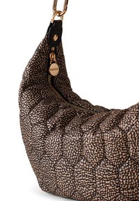Quilted black and beige handbag with a rounded shape. Features a gold zipper, leather accents, and a distinctive pattern on the fabric.