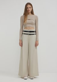 Calliope A PALAZZO - Stoffhose - beige