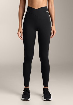 HIGH RISE COMPRESSIVE ANKLE-LENGTH WITH CUT OUT WAIST 33761254 - Legíny - black