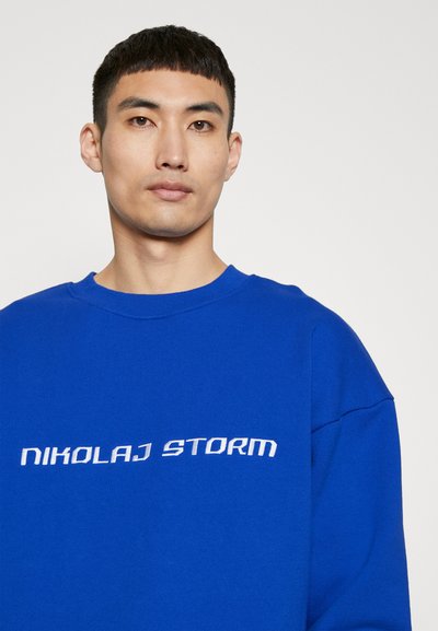 Nikolaj Storm RODEO UNISEX - Bluză de molton - logo blue