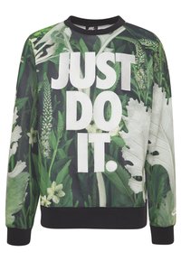 Crewneck sweatshirt med ett grönt bladmönster och "JUST DO IT." i stora vita bokstäver. Svarta mudd och avslut fulländar designen.