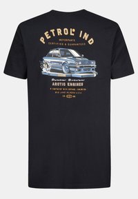 Black cotton t-shirt featuring a graphic of a blue car with text "PETROL IND," accented in beige, and additional details below the illustration.