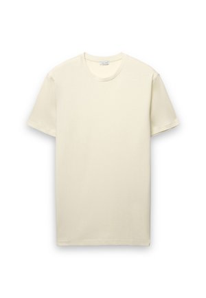 T-shirt a maniche corte color crema chiaro, realizzata in morbido cotone. Presenta una scollatura rotonda e un design semplice e classico senza motivi o dettagli.