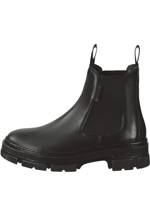 Black leather Chelsea boot with elastic side panels, rounded toe, and thick rubber sole featuring textured tread for grip.