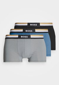 Three pairs of men's boxer briefs in gray, blue, and black. Each has a wide elastic waistband with "BOSS" and gold, black, and white stripes.