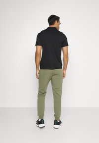 Lacoste Sport SPORTS TROUSERS - Calças de fato de treino - tank
