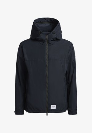 Marineblaue leichte Jacke mit Kapuze, Frontreißverschluss und elastischen Bündchen. Verfügt über ein kleines Markenetikett am unteren Saum. Glattes Material.