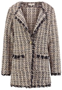 Tweedblazer med ett svart och krämfärgat mönster, fransdetaljer längs kanterna, två framfickor och en enda guldknapplåsning.