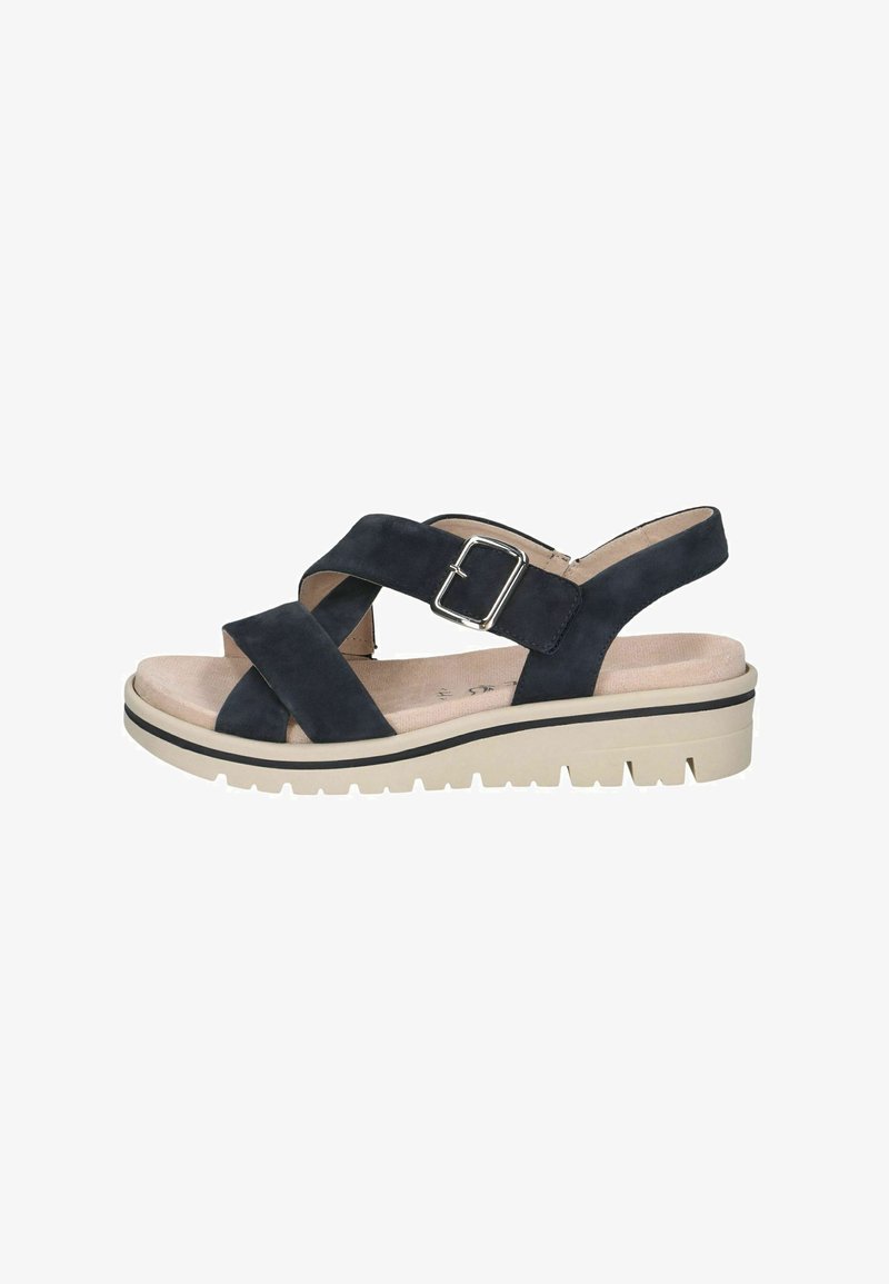 Sandale en suède bleu marine avec lanières croisées et boucle, dotée d'une semelle épaisse beige et d'une bande de roulement texturée pour une meilleure adhérence, conçue pour le confort et la stabilité.