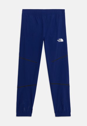 Blauwe sportbroek met elastische tailleband en boorden, twee zijzakken, zwarte diagonale naden en wit The North Face-logo op het rechterdijbeen.
