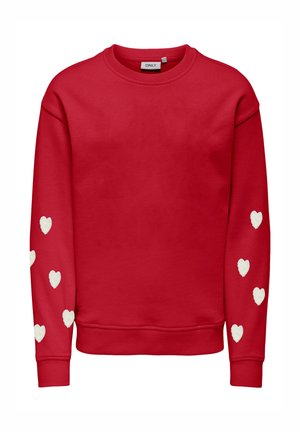 Roter Sweatshirt mit langen Ärmeln, bedruckt mit weißen Herzformen entlang beider Ärmel und rundem Ausschnitt.