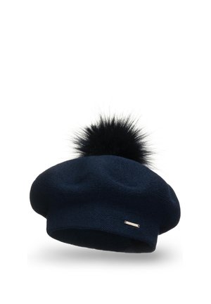 Boina de punto azul marino con un pompón negro en la parte superior. Presenta una textura suave y una pequeña etiqueta metálica en el lateral.