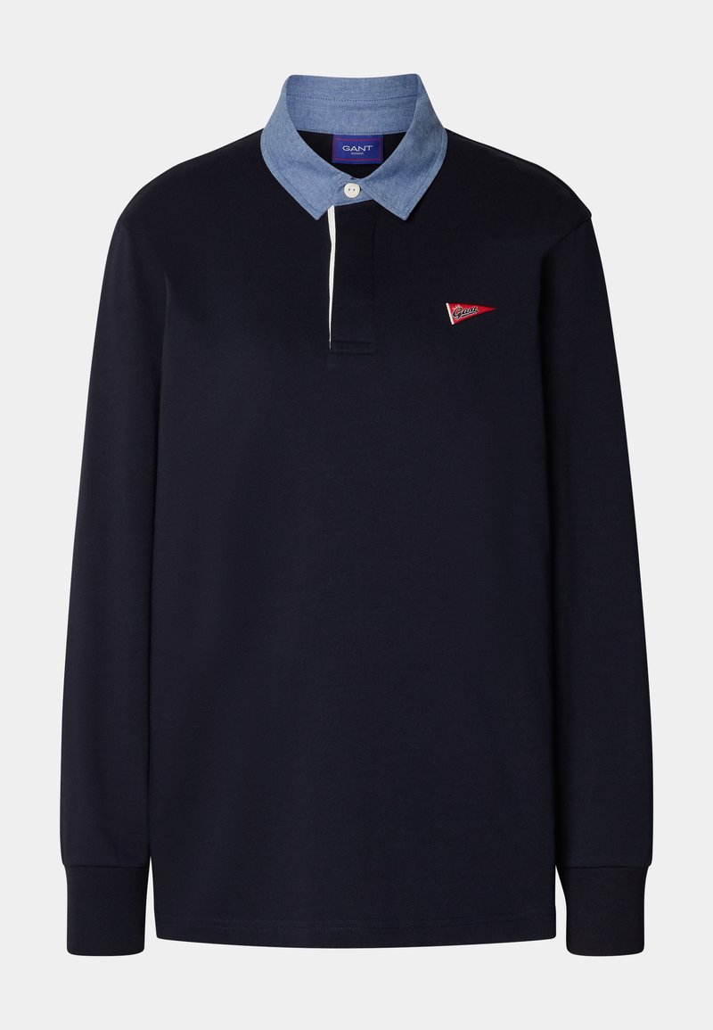 Marineblaues Langarm-Polohemd mit einem hellblauen Chambray-Kragen, ausgestattet mit einem roten Logodetail und einer Knopfleiste mit drei Knöpfen. Aus Baumwollmaterial.