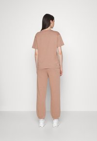 Champion Rochester ELASTIC CUFF PANTS - Spodnie treningowe