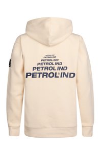 Sudadera beige clara con capucha, que presenta el texto repetido "PETROL IND" en azul oscuro en la parte trasera, fabricada en suave algodón y con puños de canalé.