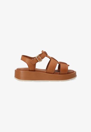 Bruine leren plateau-sandalen met brede banden, een verstelbare gesp en een gestructureerde binnenzool. De zool is wit met een gripvloer.