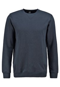 Laivastonsininen collegepaita puuvillasekoitetta, jossa on V-kaula-aukko, pitkät hihat, resorit hihansuissa ja helmassa, sekä sileä ja pehmeä pinta.