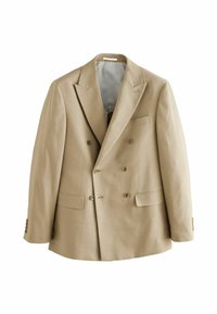 Blazer beige doppiopetto con rever a punta, due tasche frontali e bottoni marroni. Tessuto liscio e forma strutturata. Interno foderato.