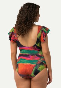 Multikleurige badpak met ruffles aan de mouwen, een lage rug en een abstract patroon met heldere tinten roze, groen en oranje.