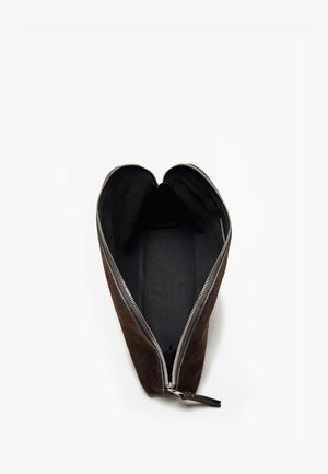 Brown suede pouch with a zipper closure, featuring a smooth interior lining and narrow, elongated shape. Minimalist design, no additional accents.